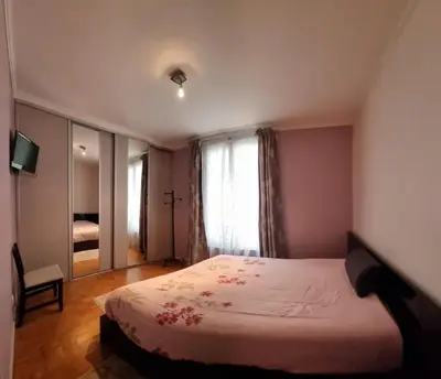 Un ou plusieurs lits dans un hébergement de l'établissement APPARTEMENT 2 CHAMBRE A 10 MINUTE DU CENTRE DE PARIS