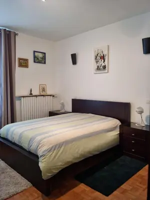 Un ou plusieurs lits dans un hébergement de l'établissement APPARTEMENT 2 CHAMBRE A 10 MINUTE DU CENTRE DE PARIS