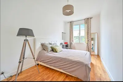 Un ou plusieurs lits dans un hébergement de l'établissement Beautiful 3 bdr apartment with garden close to Champs-Elysées