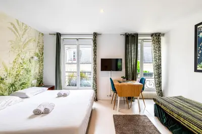 Un ou plusieurs lits dans un hébergement de l'établissement GuestReady - Bel Apt. au cœur de Paris