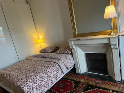 Un ou plusieurs lits dans un hébergement de l'établissement Montmartre belle vue