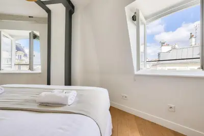 Un ou plusieurs lits dans un hébergement de l'établissement Nid élégant avec climatisation - Paris 3