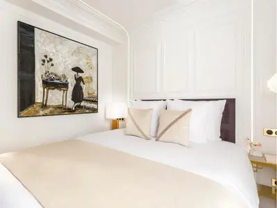 Un ou plusieurs lits dans un hébergement de l'établissement Merveil - Luxury Suite - Louvre - Aboukir IX