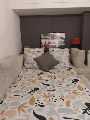 Un ou plusieurs lits dans un hébergement de l'établissement Appartement cosy dans le marais
