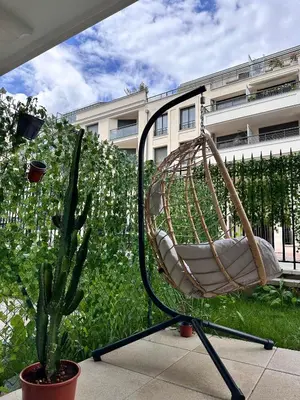 Jardin de l'établissement Boho style apartment - 7 mins from Paris Center - Garden and underground parking