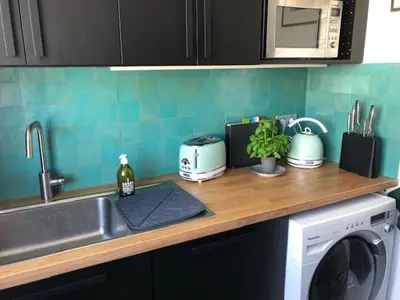 Cuisine ou kitchenette dans l'établissement Appartement design