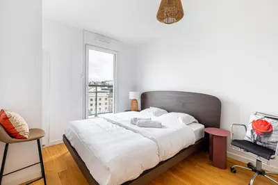 Un ou plusieurs lits dans un hébergement de l'établissement GuestReady - Chic cocoon with a balcony
