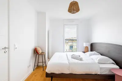 Un ou plusieurs lits dans un hébergement de l'établissement GuestReady - Chic cocoon with a balcony