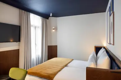 Un ou plusieurs lits dans un hébergement de l'établissement Hôtel Gabbie