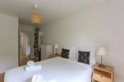 Un ou plusieurs lits dans un hébergement de l'établissement Cozy 60 m on the outskirts of Paris