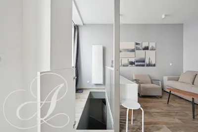 Coin salon dans l'établissement Roxane, 2 chambres dont une en souplex Paris 14e
