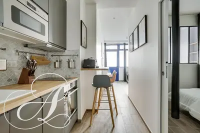 Cuisine ou kitchenette dans l'établissement Cyrano, Appartement moderne 2 chambres Paris 14eme