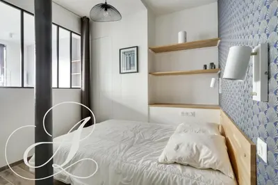 Un ou plusieurs lits dans un hébergement de l'établissement Cyrano, Appartement moderne 2 chambres Paris 14eme