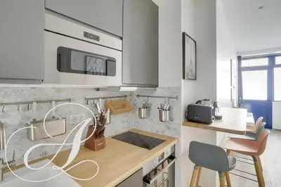 Cuisine ou kitchenette dans l'établissement Cyrano, Appartement moderne 2 chambres Paris 14eme