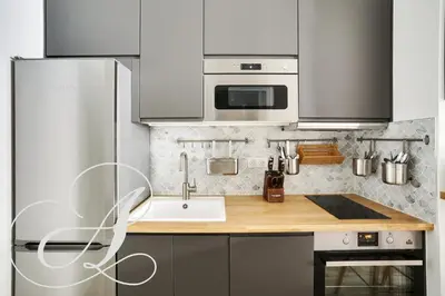 Cuisine ou kitchenette dans l'établissement Cyrano, Appartement moderne 2 chambres Paris 14eme