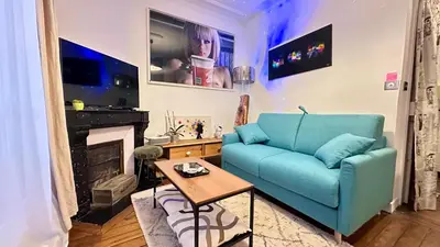 Coin salon dans l'établissement 2 Pièces de charme Montmartre