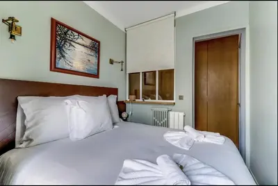 Un ou plusieurs lits dans un hébergement de l'établissement Le Rêve d'Ava - Lumineux & Proche Tour Eiffel by Mon Petit Faré