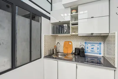 Cuisine ou kitchenette dans l'établissement Atypique Loft 3 personnes with AC by Weekome