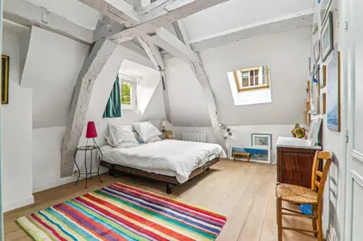 Un ou plusieurs lits dans un hébergement de l'établissement Cosy apartment Place des Vosges