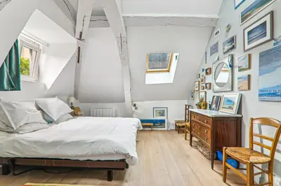 Un ou plusieurs lits dans un hébergement de l'établissement Cosy apartment Place des Vosges