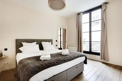 Un ou plusieurs lits dans un hébergement de l'établissement Pick A Flat's Apartment in Le Marais - Rue Sainte Croix de la Bretonnerie