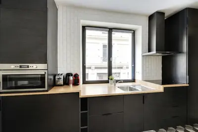 Cuisine ou kitchenette dans l'établissement Pick A Flat's Apartment in Le Marais - Rue Sainte Croix de la Bretonnerie