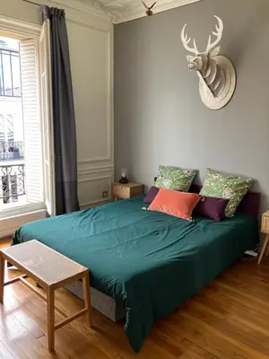 Un ou plusieurs lits dans un hébergement de l'établissement Chambre capitale Saint Lazare