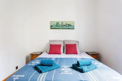 Un ou plusieurs lits dans un hébergement de l'établissement Bel appartement aux portes de Paris