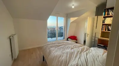 Un ou plusieurs lits dans un hébergement de l'établissement Modern apartment close to Paris