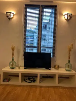 Télévision ou salle de divertissement dans l'établissement Havre de paix Paris 9