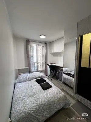 Un ou plusieurs lits dans un hébergement de l'établissement Charming Studio Eiffel Tower