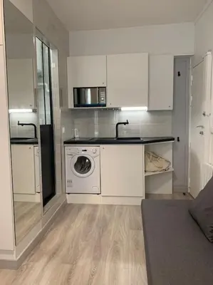 Cuisine ou kitchenette dans l'établissement Charming Studio Eiffel Tower