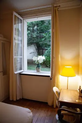 Un ou plusieurs lits dans un hébergement de l'établissement Arc de Triomphe Chic Room