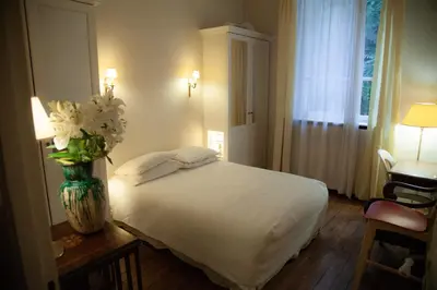 Un ou plusieurs lits dans un hébergement de l'établissement Arc de Triomphe Chic Room