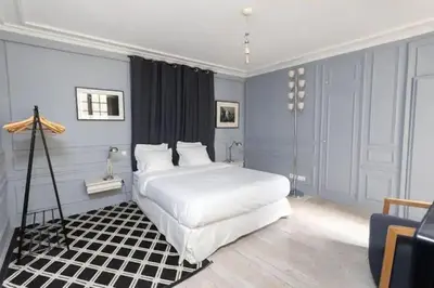 Un ou plusieurs lits dans un hébergement de l'établissement Saint-Honoré Luxurious 2 Bedrooms apartment 120m2
