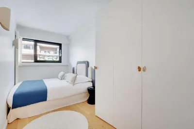 Un ou plusieurs lits dans un hébergement de l'établissement Passy - Eiffel Tower - Amazing 2BR with garden