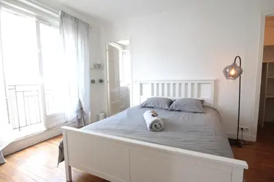 Un ou plusieurs lits dans un hébergement de l'établissement Spacieux 2 Pièces Montmartre