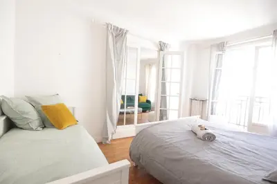 Un ou plusieurs lits dans un hébergement de l'établissement Spacieux 2 Pièces Montmartre