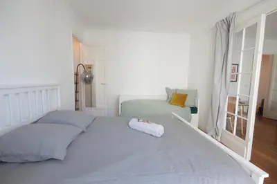 Un ou plusieurs lits dans un hébergement de l'établissement Spacieux 2 Pièces Montmartre