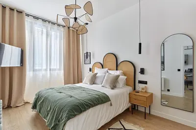 Un ou plusieurs lits dans un hébergement de l'établissement Apartment Center of Paris Bastille by Studioprestige