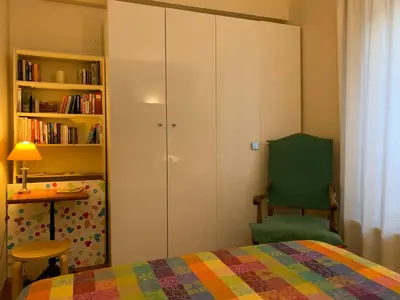 Un ou plusieurs lits dans un hébergement de l'établissement Chaleureux 3 pièces haussmanien au cœur du Quartier Latin