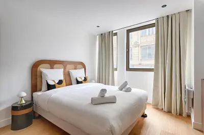 Un ou plusieurs lits dans un hébergement de l'établissement Appartement Design au coeur du Sentier