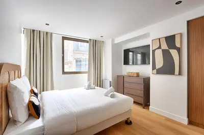 Un ou plusieurs lits dans un hébergement de l'établissement Appartement Design au coeur du Sentier