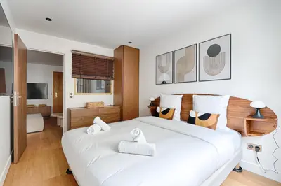 Un ou plusieurs lits dans un hébergement de l'établissement Appartement Design au coeur du Sentier