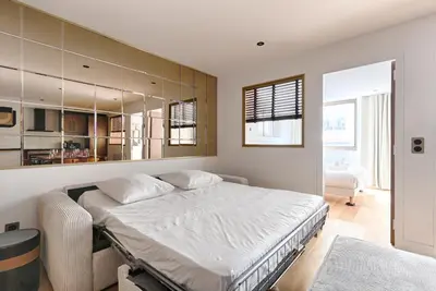 Un ou plusieurs lits dans un hébergement de l'établissement Appartement Design au coeur du Sentier