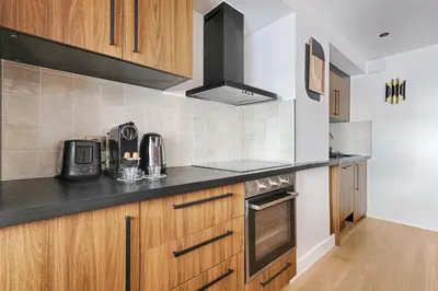 Cuisine ou kitchenette dans l'établissement Appartement Design au coeur du Sentier