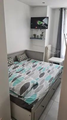 Un ou plusieurs lits dans un hébergement de l'établissement Appartement Métro Plateau de Vanves - Malakoff