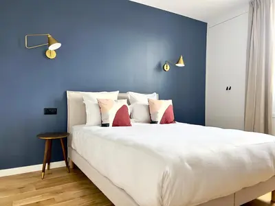 Un ou plusieurs lits dans un hébergement de l'établissement Pick A Flat's Apartment in Grands-Boulevards - Boulevard Saint-Denis