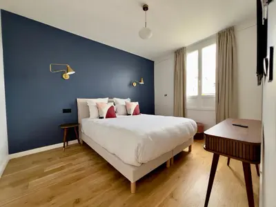 Un ou plusieurs lits dans un hébergement de l'établissement Pick A Flat's Apartment in Grands-Boulevards - Boulevard Saint-Denis