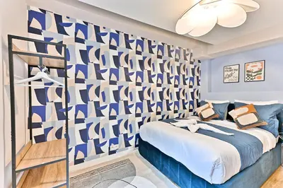 Un ou plusieurs lits dans un hébergement de l'établissement Appartement 3 chambres proche Châtelet-Les Halles